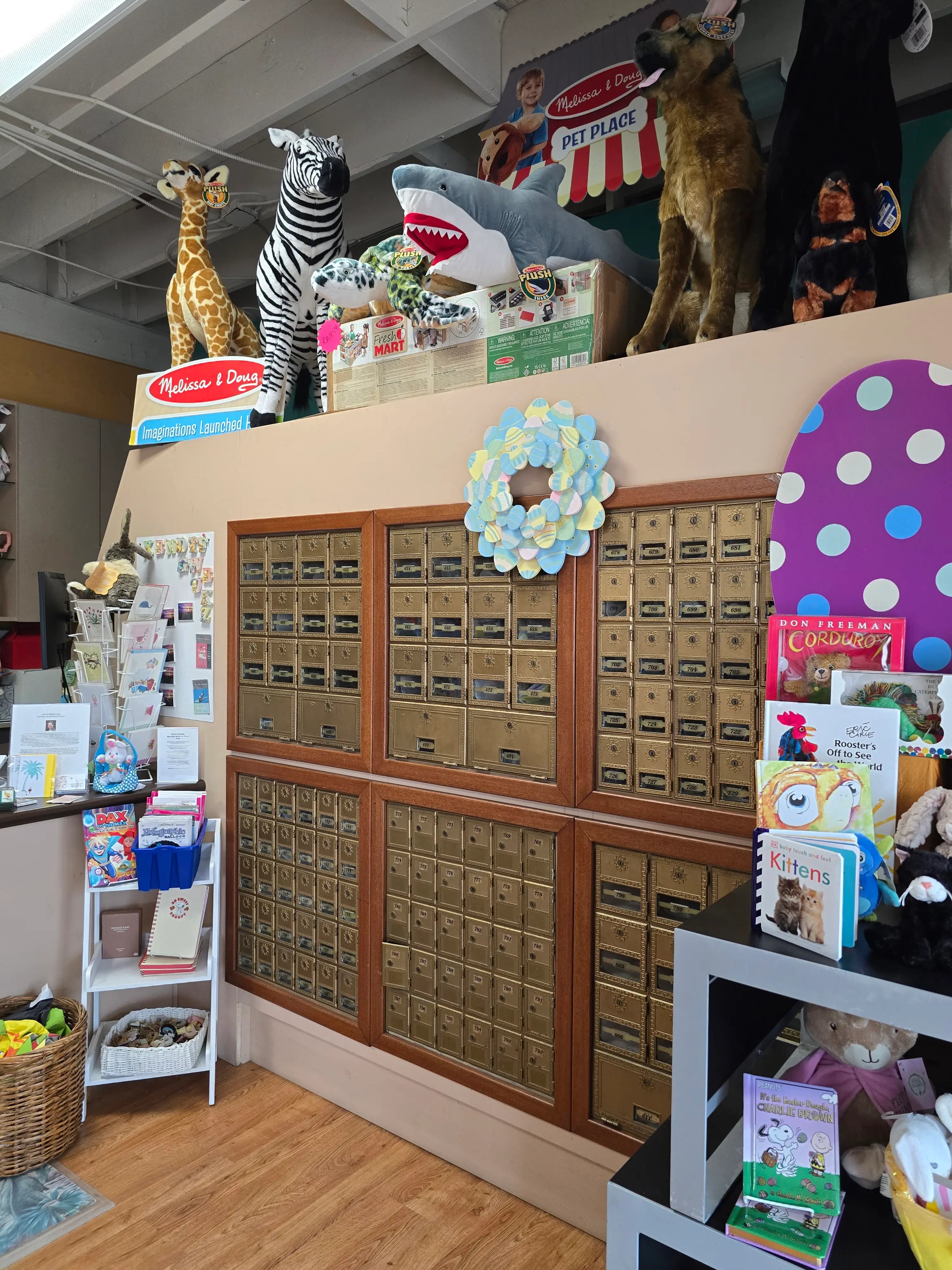 Store interior with toy display and mailboxes